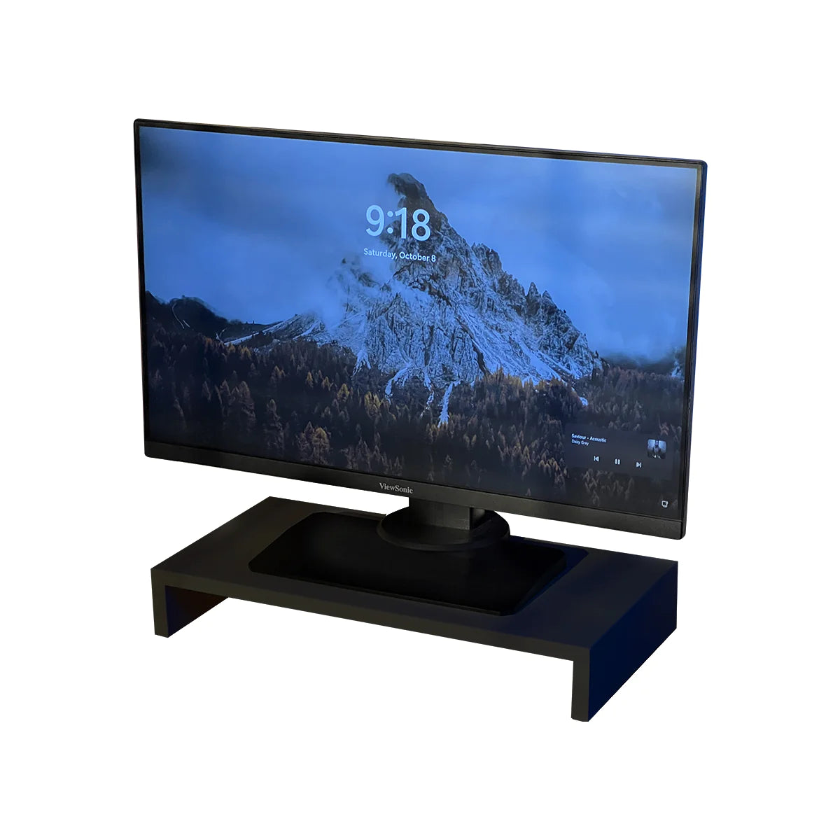 Sleek stand riser by woodsy with a monitor displaying mountain wallpaper, isolated on white background.