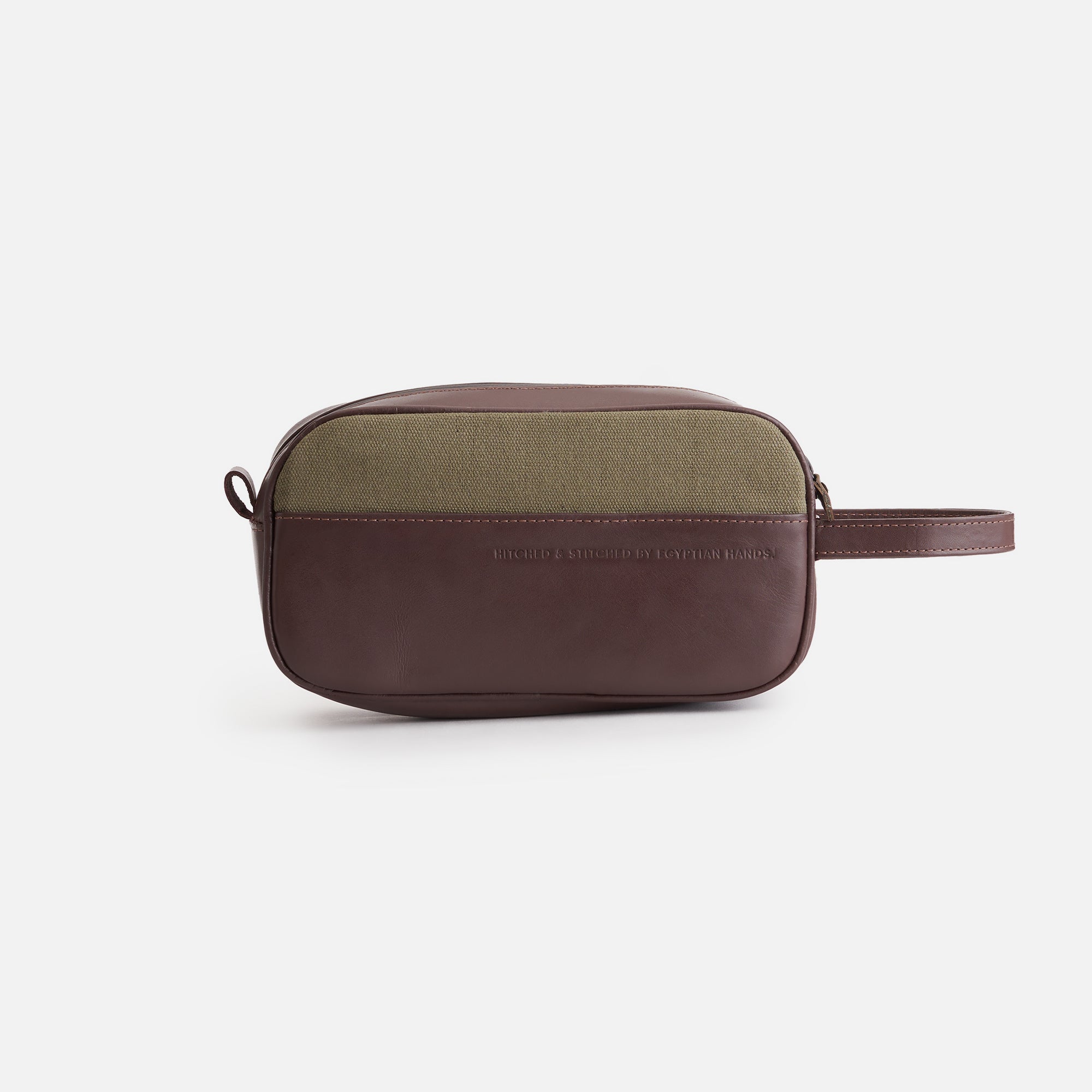 Olive and brown leather toiletry bag isolated on white background.