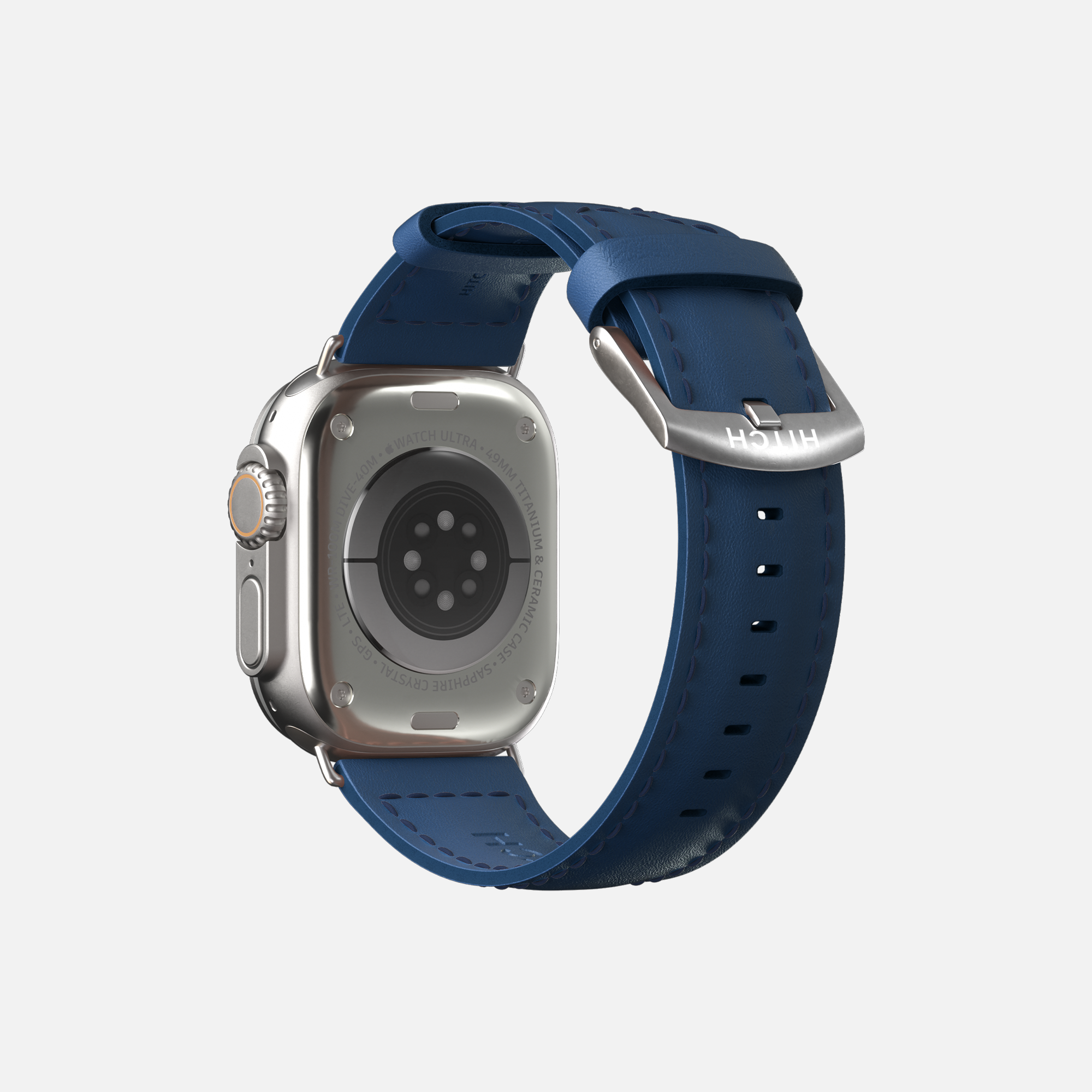 Rear view of an Apple Smartwatch with blue strap, digital crown, side button, and heart rate sensors on a white background.